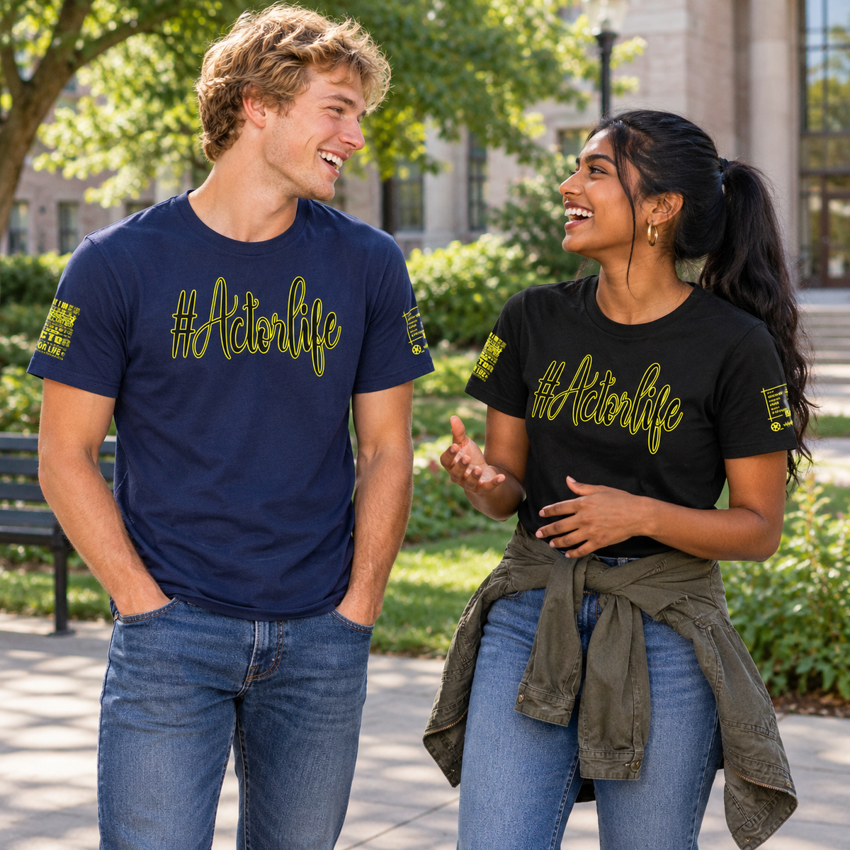 Two models outdoors wearing matching graphic t-shirts with '#Actionlife' printed in yellow-green. The man wears a navy blue shirt and the woman wears a black shirt.
